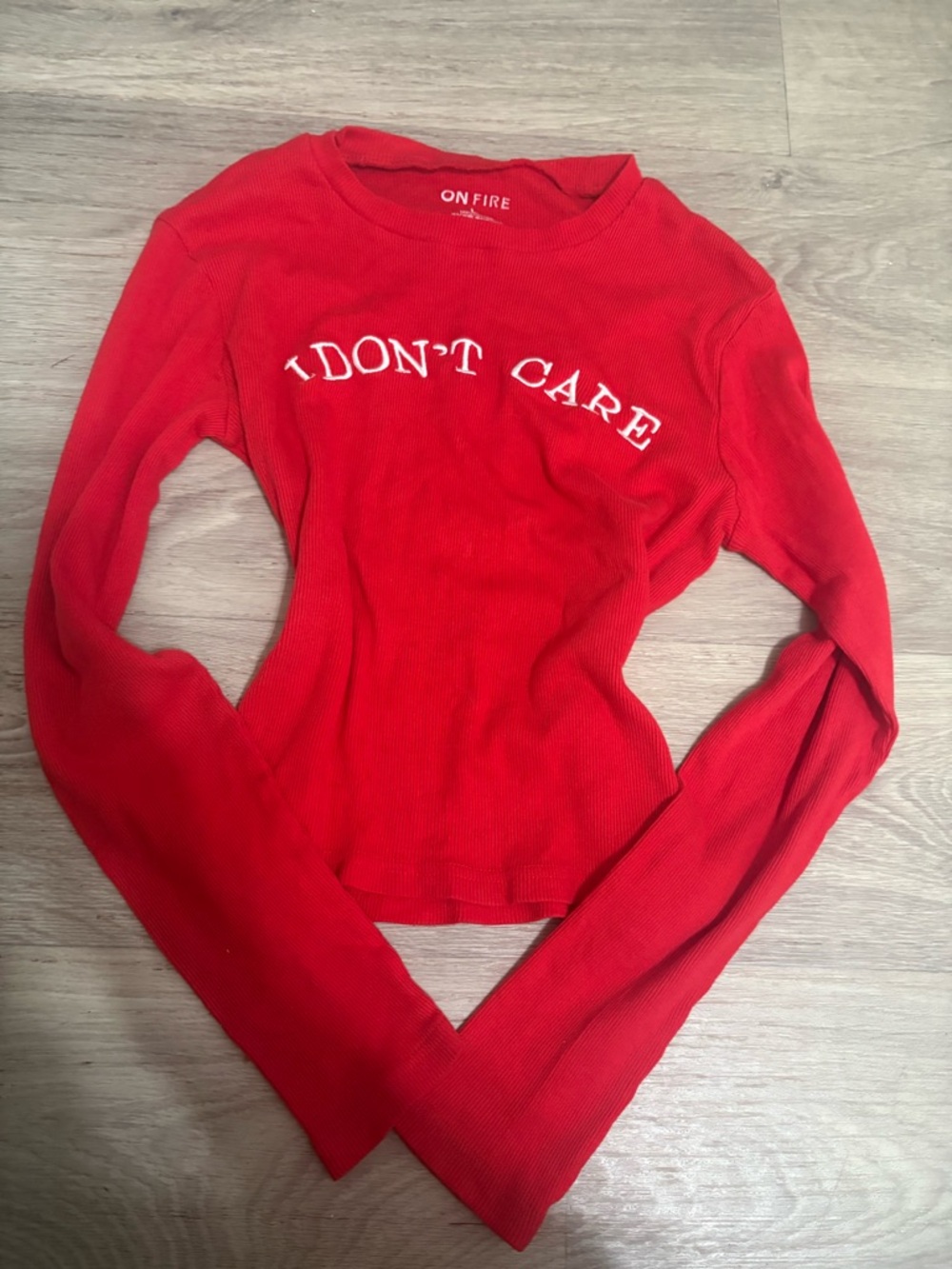 On Fire Red Ribbed Long Sleeve Top with "I DON'T CARE" Graphic